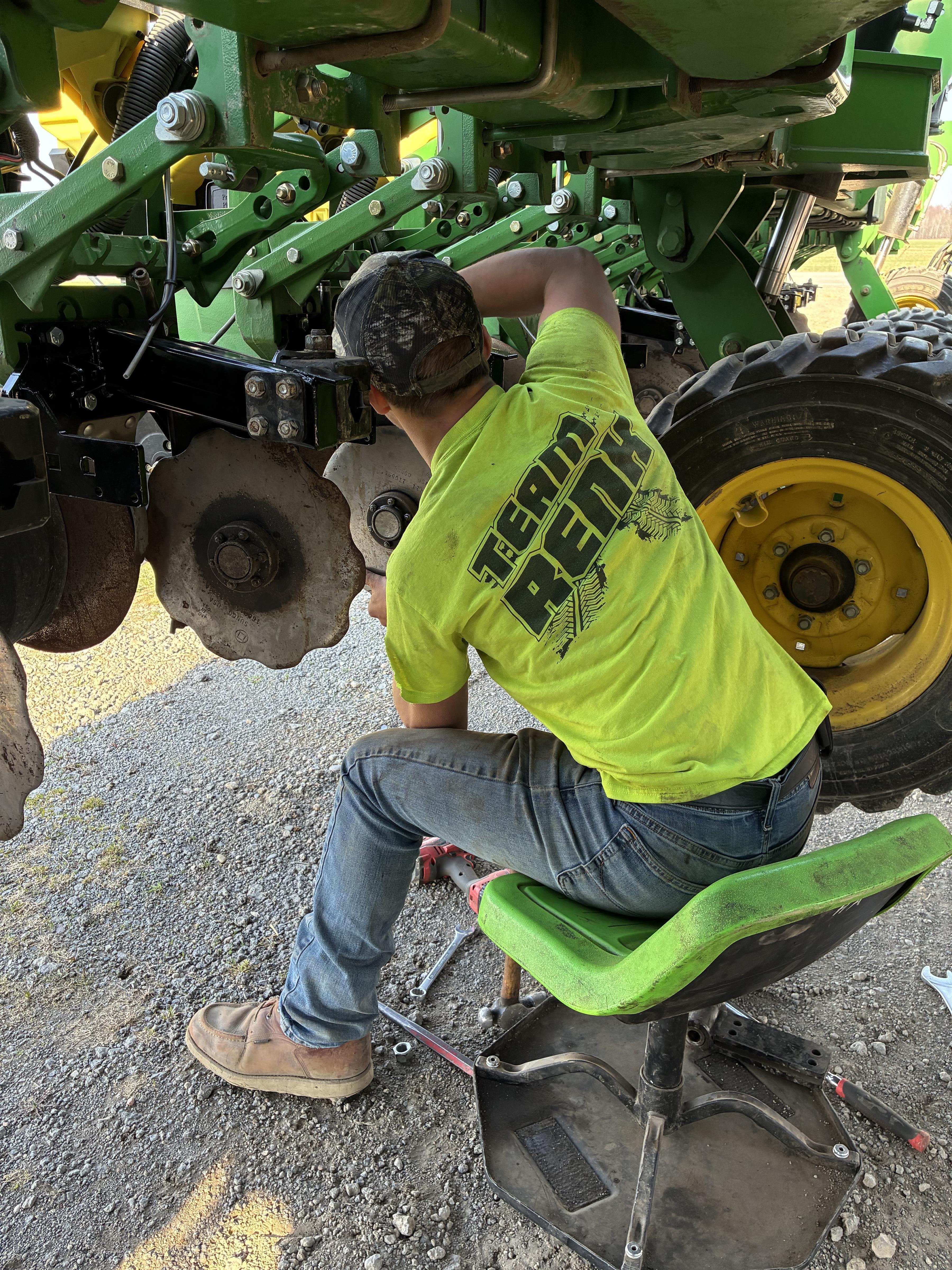 Griffin Messing FFA Ubly Working on Farm Equipment