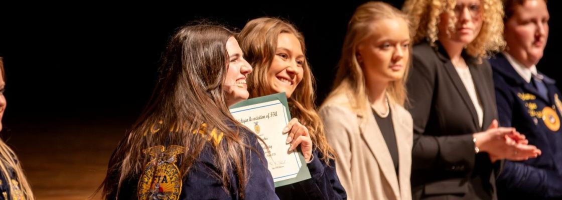 Student receiving scholarship