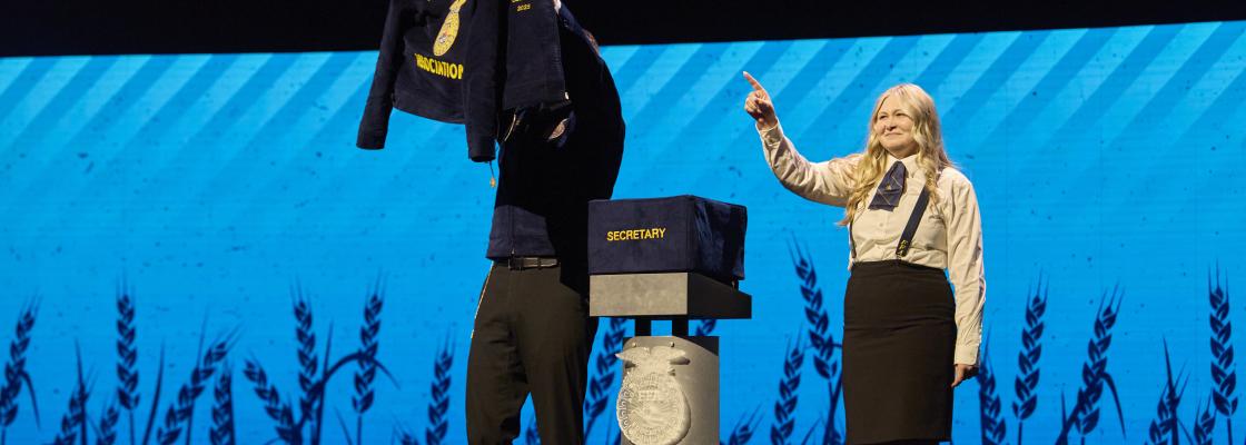 National Officer pointing to jacket