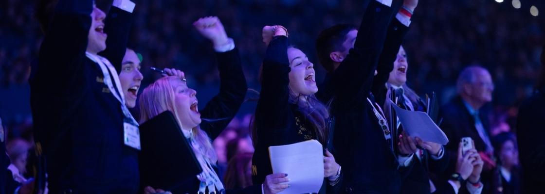 Students celebrating during National Convention session
