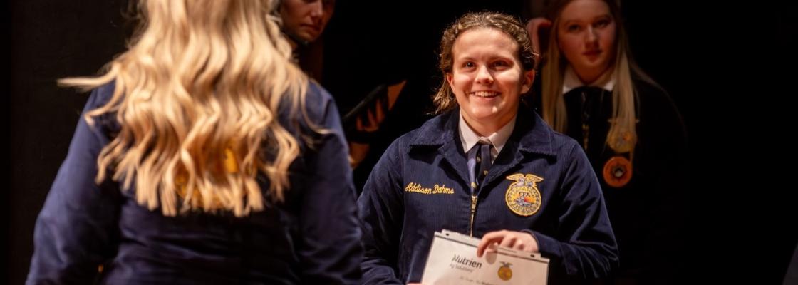 Student receiving Outstanding Junior Award