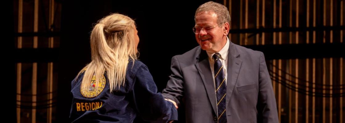 Member receiving State Degree