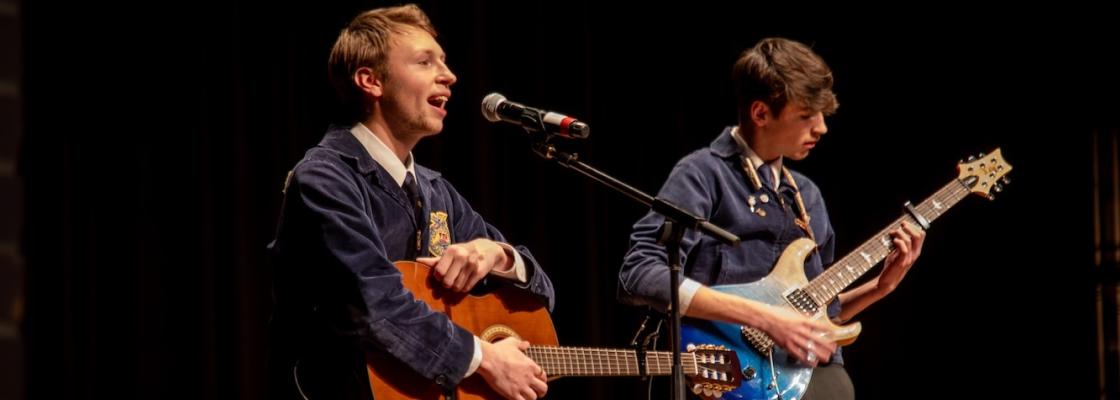 Students singing and playing guitar as part of State Talent