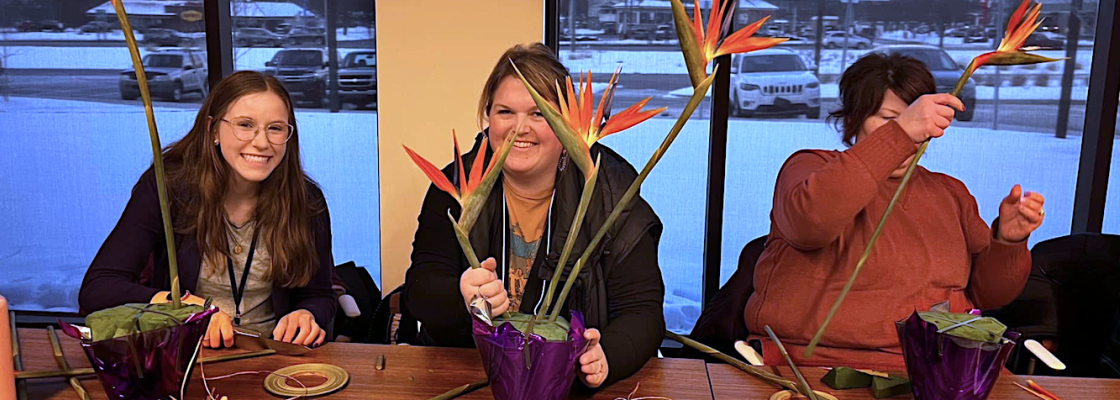 Teachers participating in a floral workshop