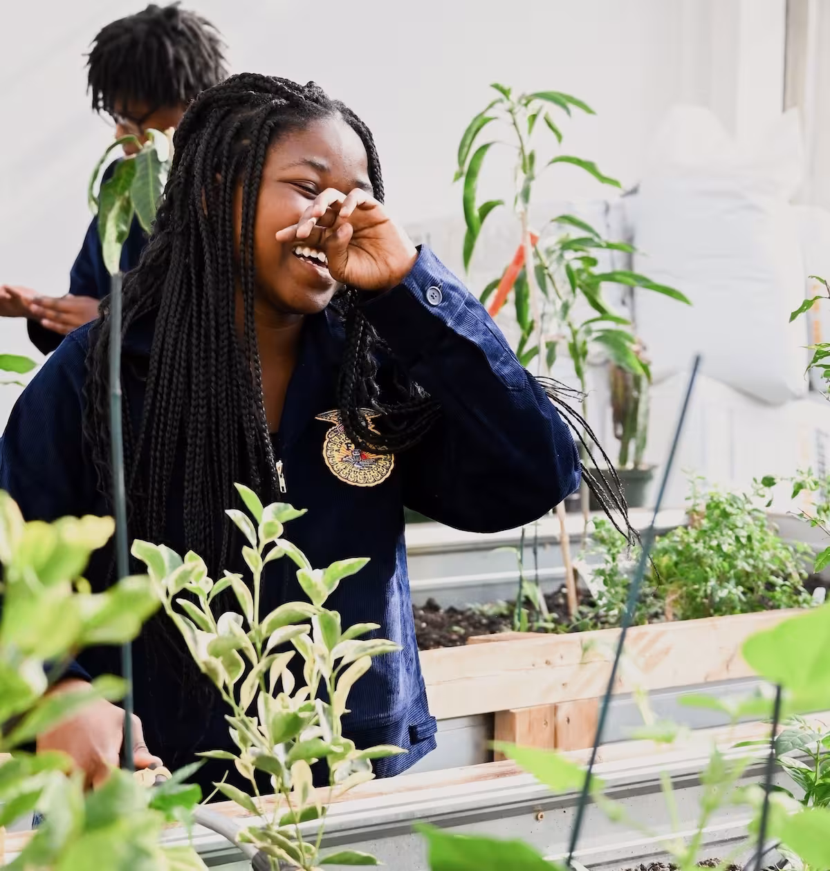 Student in greenhouse